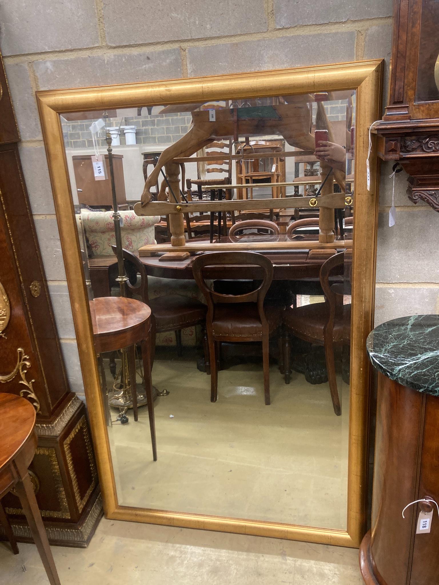 A contemporary rectangular gilt framed wall mirror, W.150cm H.96cm